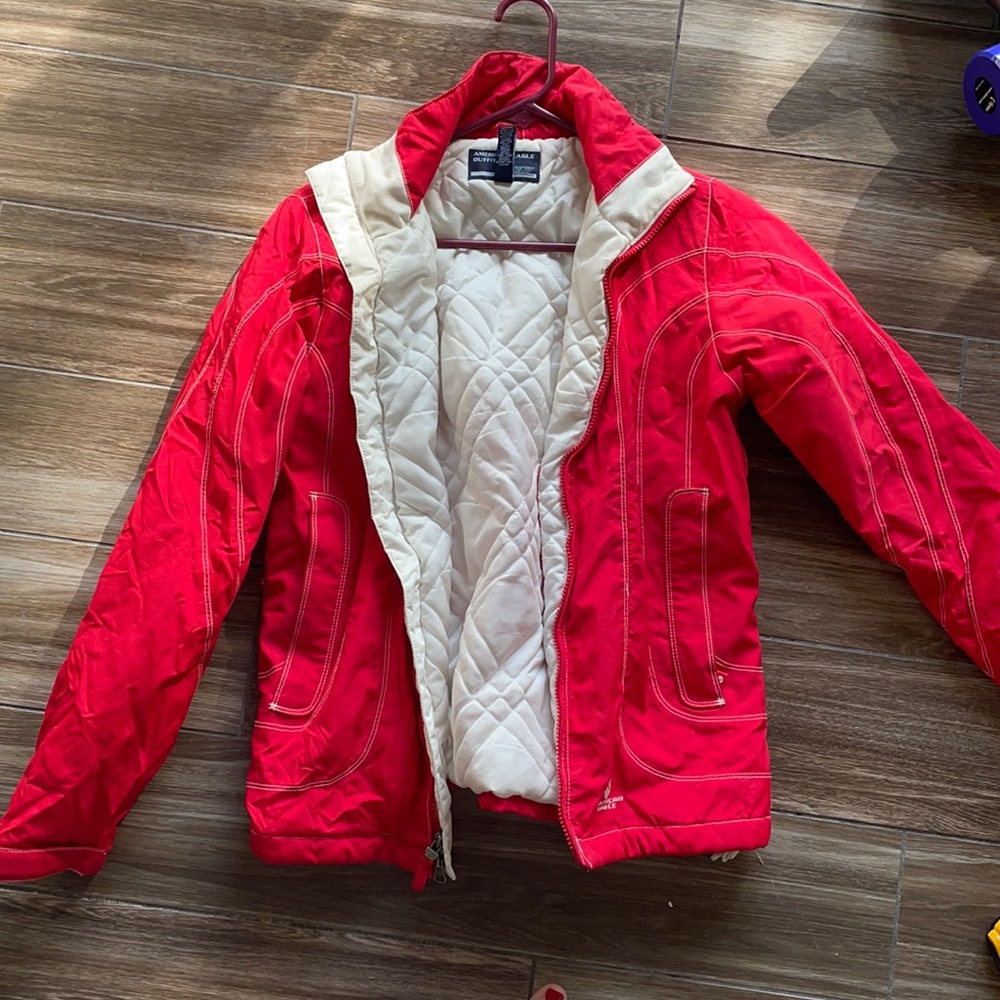 Ref and white ski jacket